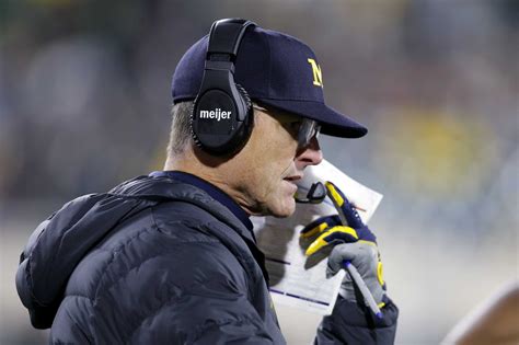 Michigan's Jim Harbaugh banned for rest of regular season