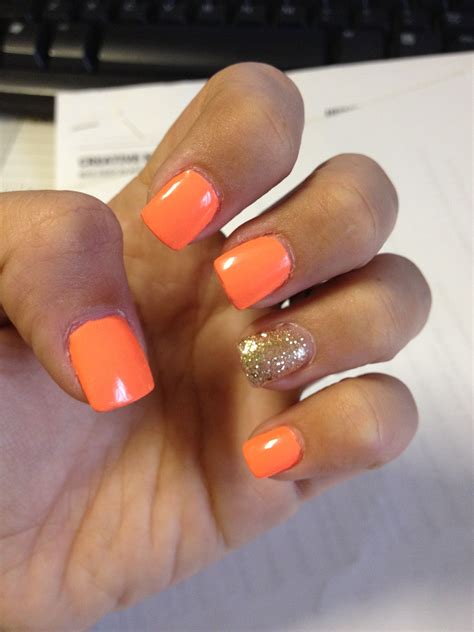 neon orange with gold glitter gel nails | Orange acrylic nails, Glitter gel nails, Neon orange nails