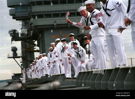 Sailors on board USS HARRY S. TRUMAN (CVN 75) man the rails for their arrival at pier 12 at ...