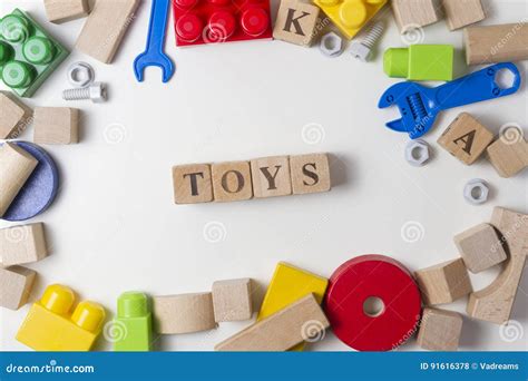 Toys Word Written in Wooden Cubes. Children Toy on White Background As Frame with Copy Space for ...