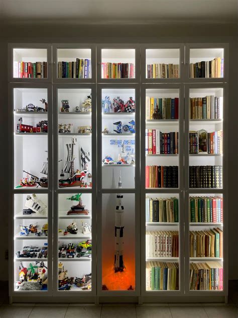 DIY Saturn V and other lego and books display in IKEA Billy Bookcase with LED lights. Lego ...