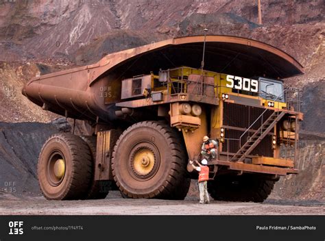 A giant dump truck in a quarry stock photo - OFFSET