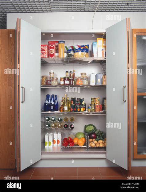 Modern kitchen larder with stainless steel racking shelves Stock Photo ...