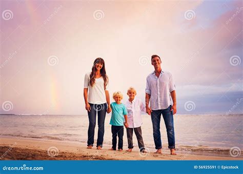 Family on the Beach at Sunset Stock Image - Image of adult, sand: 56925591