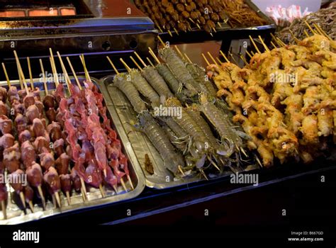 Exotic food at night food market on Donganmen street Beijing China Stock Photo, Royalty Free ...