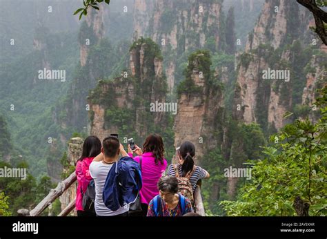 Wulingyuan, China - May 27, 2018: Tourists on pathway in Tianzi Avatar mountains nature park ...