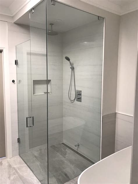 Corner glass shower enclosures : Glass Ninja . Get a custom quote today!