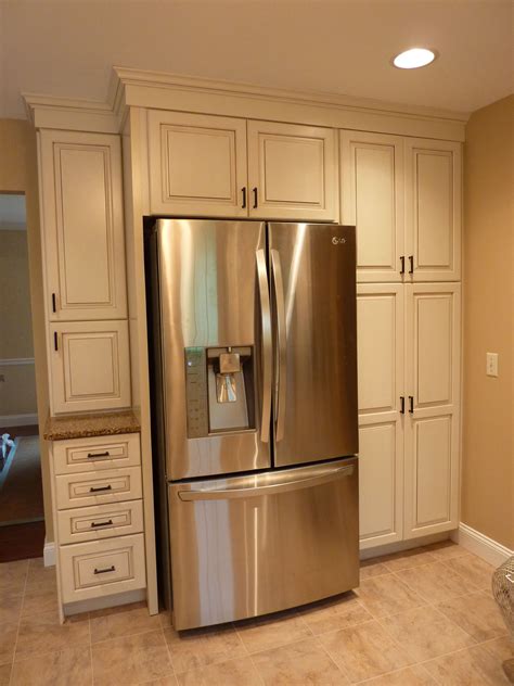 Kraftmaid offwhite cabinets with a glaze, build in the refrigerator with plenty of storage and a ...