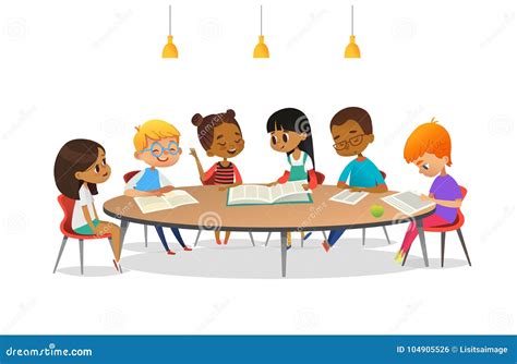 Boys And Girls Sitting Around Round Table, Studying, Reading Books And Discuss Them. Kids ...