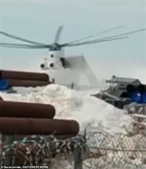 Shocking moment Mi-26 helicopter spins out of control shortly after take-off in Russia as eight ...