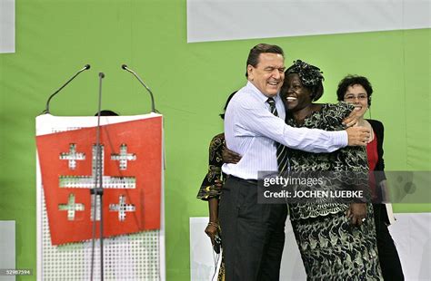 German Chancellor Gerhard Schroeder hugs Kenya's Nobel Peace Prize... News Photo - Getty Images