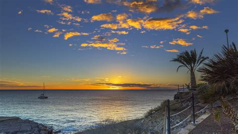 Sunset on the Playa Fanabe beach in Tenerife, Spain - backiee