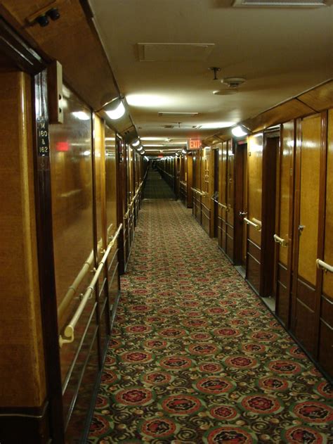 Queen Mary Historic Ocean Liner In Long Beach, Ca. A view looking down one of long passage ways ...