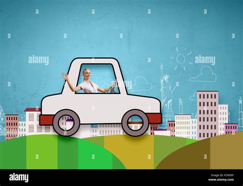 Young girl driving drawn little funny car Stock Photo - Alamy