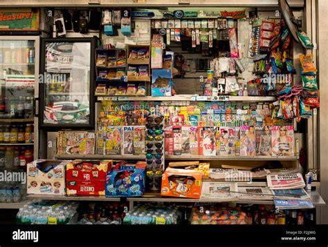 A cluttered Manhattan newsstand selling newspapers, magazines, snacks, sodas, sunglasses and ...