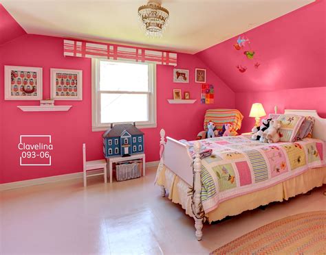 a bedroom with pink walls and white furniture
