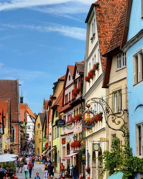 Typical street view with beautiful flowers everywhere in the medieval ...