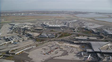 6K stock footage aerial video of an orbit of John F. Kennedy International Airport in Autumn ...