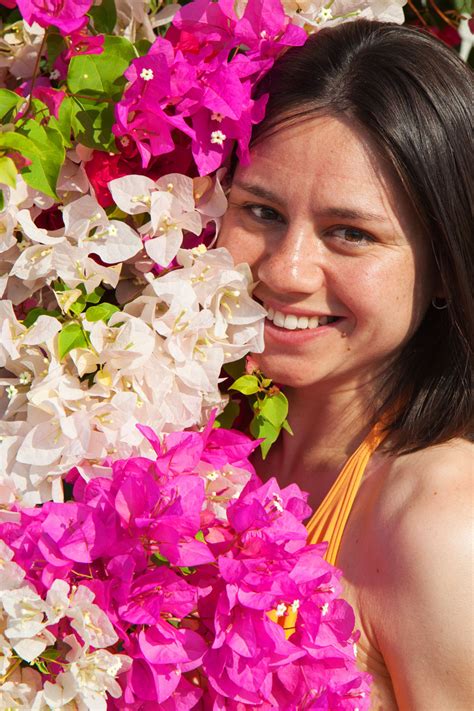 Young Woman Surrounded With Flowers Free Stock Photo - Public Domain ...