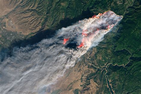 Fast-moving wildfires prompt tens of thousands of evacuations in both ...