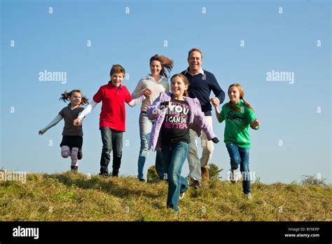 Happy family outdoors Stock Photo - Alamy