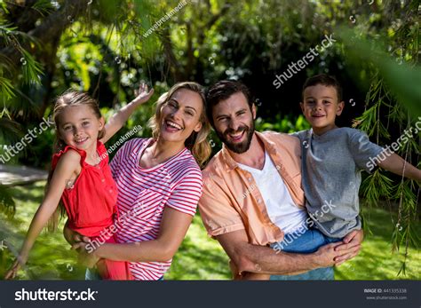 Portrait Happy Parents Carrying Smiling Children Stock Photo 441335338 | Shutterstock