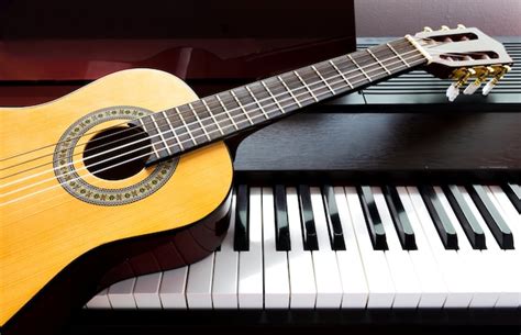 Premium Photo | Guitar and piano. music instrument.