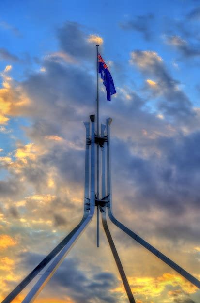 Premium Photo | The australian flag flying on top of parliament house in canberra