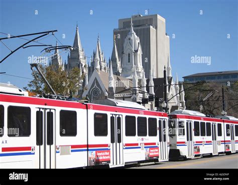 UTA TRAX light rail train on South Temple Street Salt Lake City with Tabernacle and LDS church ...