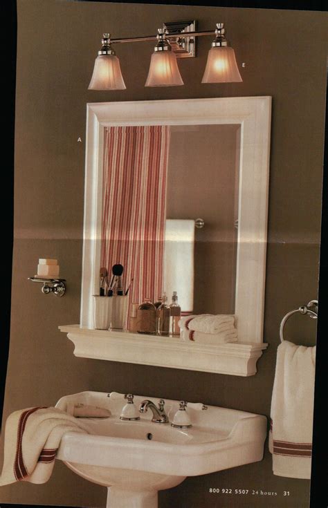 Framed bathroom mirror and shelf but with a hole in the shelf for a ...