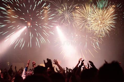 New Year Concept, Cheering Crowd and Fireworks Stock Photo - Image of explosion, festival: 129616108