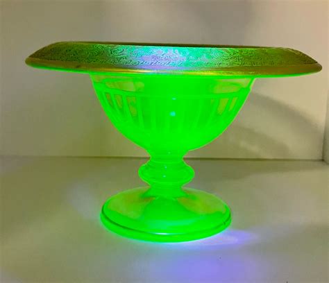 Uranium Glass with gold rim. Can you help me with identification and appraisal? I know this ...