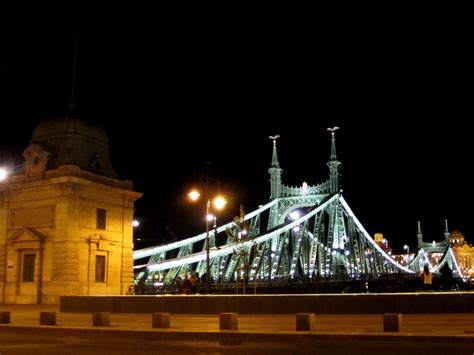 a bridge lit up at night with lights on it