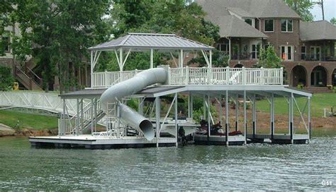 Here's a cool boat dock with a tunnel slide. #LakeLife! | Lakefront living, Lake dock, House boat