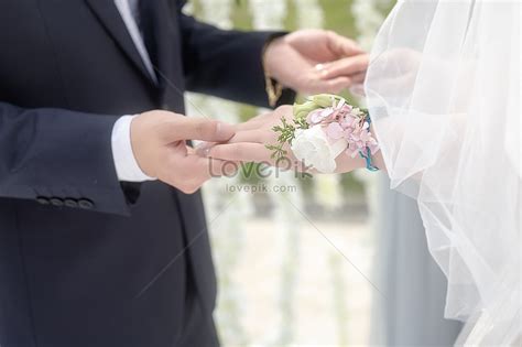 The Bride And Groom Hold Hands At An Outdoor Wedding Picture And HD ...