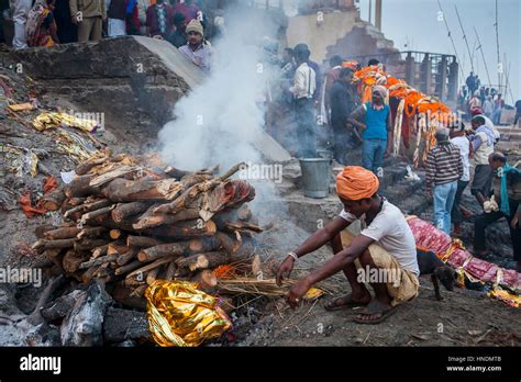 Cremation of a body, in Manikarnika Ghat, the burning ghat, on the ...