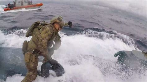 WATCH: Video Shows Coast Guard Jumping Onto Submarine | Heavy.com