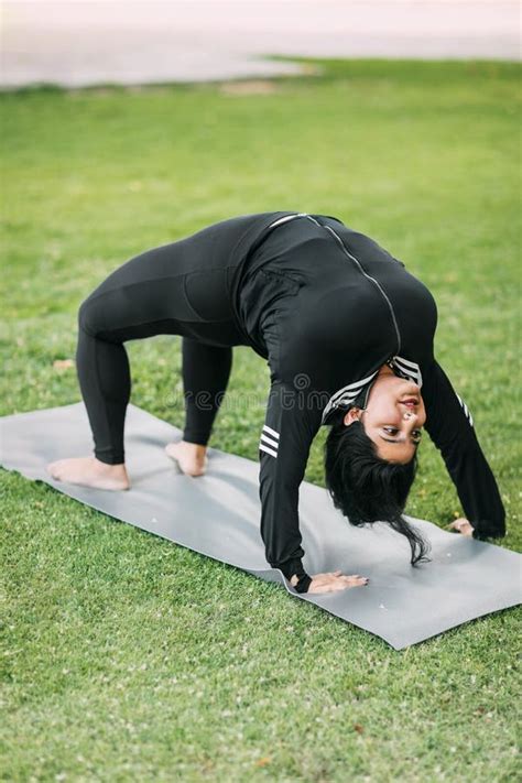 A Beautiful Indian Girl Does Yoga in a Summer Park. Healthy Lifestyle. Various Yoga Poses Stock ...