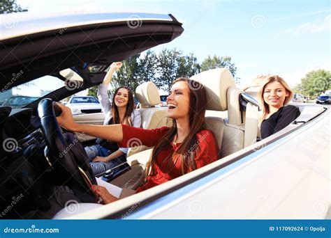 Three Girls Driving in a Convertible Car and Having Fun. Stock Photo ...