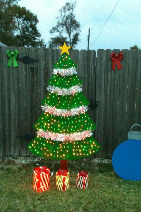 Wooden CHRISTmas tree , we made out of plywood and 250 lights and some garland | Christmas yard ...