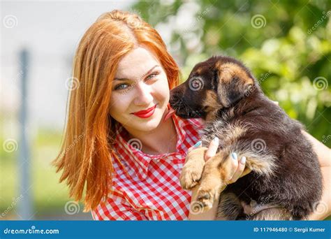 Young Smiling Woman with Puppy of German Shepherd Stock Photo - Image ...