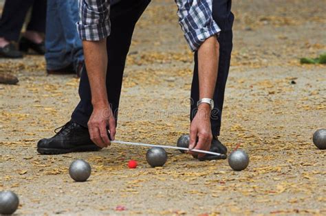 Petanque players in detail editorial photography. Image of fingers - 41196137