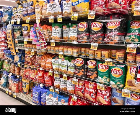 Snack chip selection at grocery store Stock Photo - Alamy