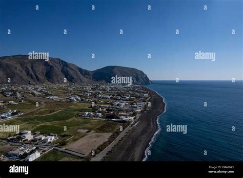 An aerial view of Santorini island surrounded by buildings Stock Photo ...