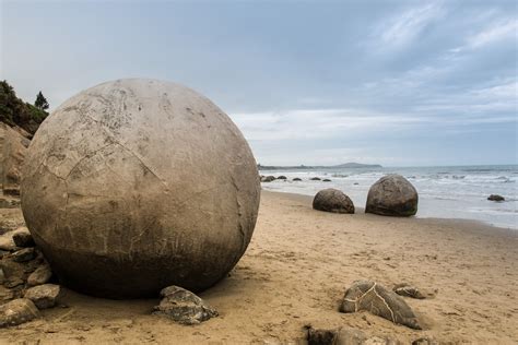 The naturally forming spherical boulders at Moeraki, New Zealand : r/pics