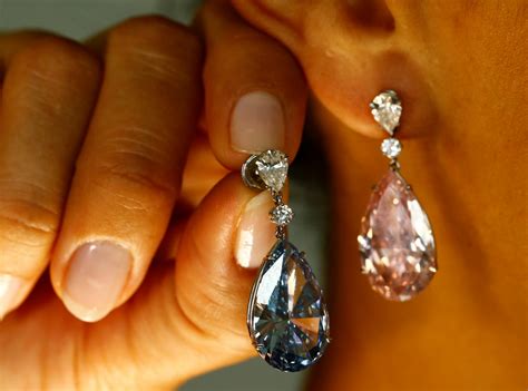 Sotheby's sells pink and blue diamond earrings for record $57m in Geneva