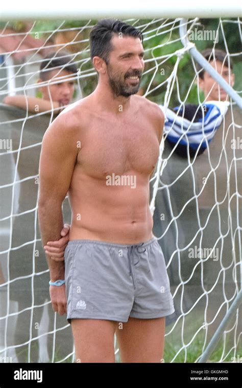 Gigi Buffon plays football in the rain with a group of young children ...