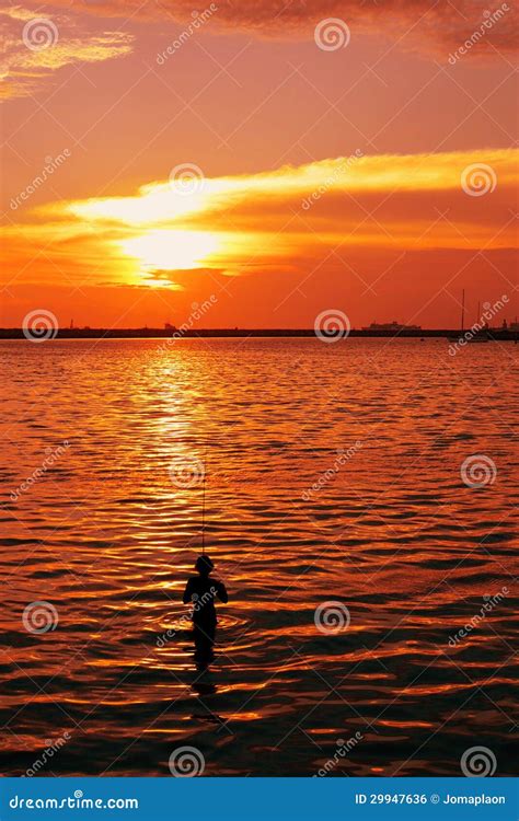 Man-fishing-during-sunset stock photo. Image of hook - 29947636