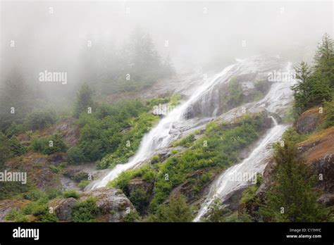 Waterfalls in fog, Endicott Arm, Alaska, USA Stock Photo - Alamy