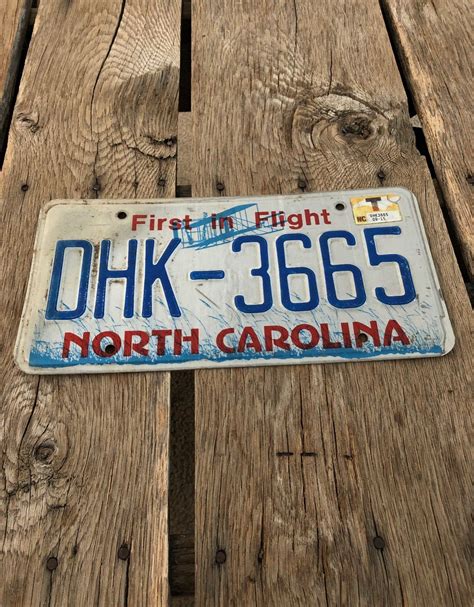 a license plate that says, first in flight dhk - 3505 north carolina